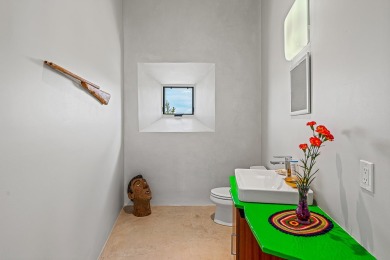 Live inside a work of art in this  Artist's Dream Dwelling in on Taos Country Club in New Mexico - for sale on GolfHomes.com, golf home, golf lot