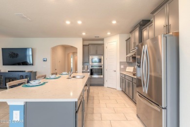 Almost New-But Even Better! Modern Elegance in Halifax on Halifax Plantation Golf Club in Florida - for sale on GolfHomes.com, golf home, golf lot