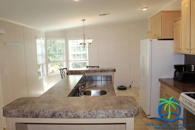 This well-maintained 2014 Nobility Lindsay, owned and occupied on Cypresswood Golf and Country Club in Florida - for sale on GolfHomes.com, golf home, golf lot