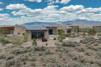 Live inside a work of art in this  Artist's Dream Dwelling in on Taos Country Club in New Mexico - for sale on GolfHomes.com, golf home, golf lot