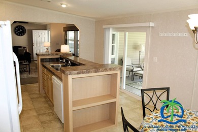 This well-maintained 2014 Nobility Lindsay, owned and occupied on Cypresswood Golf and Country Club in Florida - for sale on GolfHomes.com, golf home, golf lot