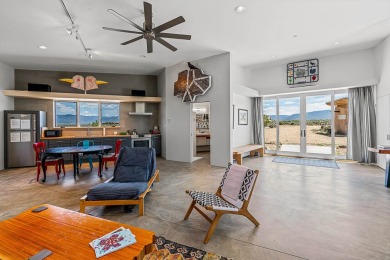 Live inside a work of art in this  Artist's Dream Dwelling in on Taos Country Club in New Mexico - for sale on GolfHomes.com, golf home, golf lot