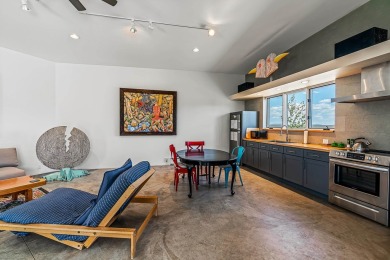 Live inside a work of art in this  Artist's Dream Dwelling in on Taos Country Club in New Mexico - for sale on GolfHomes.com, golf home, golf lot
