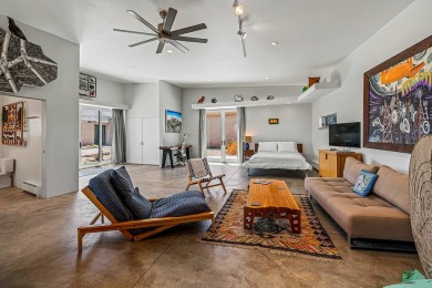 Live inside a work of art in this  Artist's Dream Dwelling in on Taos Country Club in New Mexico - for sale on GolfHomes.com, golf home, golf lot
