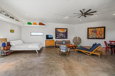 Live inside a work of art in this  Artist's Dream Dwelling in on Taos Country Club in New Mexico - for sale on GolfHomes.com, golf home, golf lot
