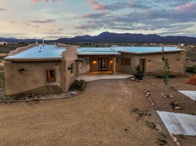 Live inside a work of art in this  Artist's Dream Dwelling in on Taos Country Club in New Mexico - for sale on GolfHomes.com, golf home, golf lot