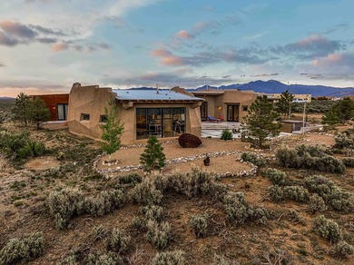 Live inside a work of art in this Artist's Dream Dwelling in on Taos Country Club in New Mexico - for sale on GolfHomes.com, golf home, golf lot