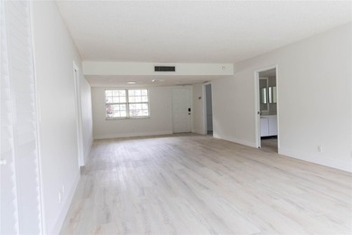 Take a look at this beautiful condo in Palm Aire with new floors on Palm-Aire Country Club and Resort - Palms in Florida - for sale on GolfHomes.com, golf home, golf lot