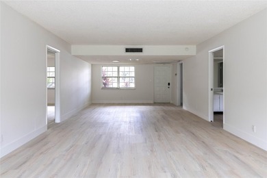 Take a look at this beautiful condo in Palm Aire with new floors on Palm-Aire Country Club and Resort - Palms in Florida - for sale on GolfHomes.com, golf home, golf lot