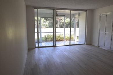 Take a look at this beautiful condo in Palm Aire with new floors on Palm-Aire Country Club and Resort - Palms in Florida - for sale on GolfHomes.com, golf home, golf lot