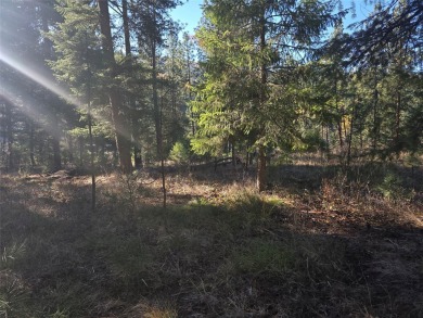 Wooded building lot in Western Montana. Lots is located in an on Trestle Creek Golf Course in Montana - for sale on GolfHomes.com, golf home, golf lot