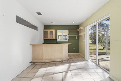 PRICED TO SELL!  A 2,390 SQ FOOT POOL HOME WITH A VIEW OF THE on Glen Lakes Country Club in Florida - for sale on GolfHomes.com, golf home, golf lot