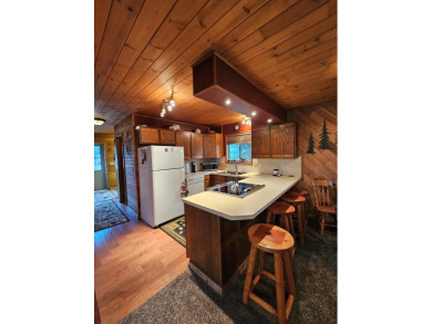 Cute as a button cabin in a great in town location! This 3 on McCall Municipal Golf Course in Idaho - for sale on GolfHomes.com, golf home, golf lot
