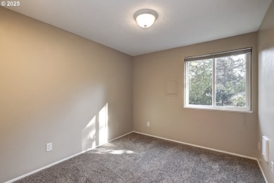 Nestled among the trees, this private top-floor condo overlooks on Rock Creek Country Club in Oregon - for sale on GolfHomes.com, golf home, golf lot