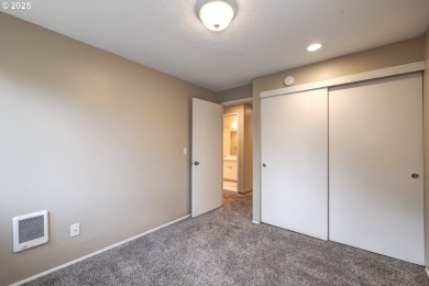 Nestled among the trees, this private top-floor condo overlooks on Rock Creek Country Club in Oregon - for sale on GolfHomes.com, golf home, golf lot
