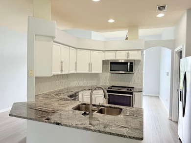 LOCATION AND MORE.   This is a gorgeous and renovated one single on Oaks National Golf Course in Florida - for sale on GolfHomes.com, golf home, golf lot