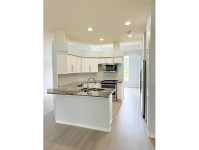 LOCATION AND MORE.   This is a gorgeous and renovated one single on Oaks National Golf Course in Florida - for sale on GolfHomes.com, golf home, golf lot