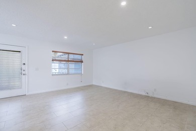 Second-floor 2 bed / 2 bath condo with garden views in the on Kings Point Golf -Flanders Way in Florida - for sale on GolfHomes.com, golf home, golf lot