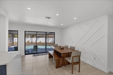 Welcome to this beautifully updated 3-bedroom, 3-bath home on Bent Tree Country Club in Florida - for sale on GolfHomes.com, golf home, golf lot