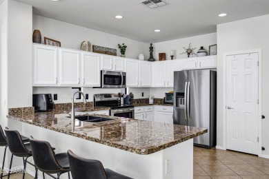 Inviting single-story with 3 beds, 2 baths, open kitchen with on Seville Golf and Country Club in Arizona - for sale on GolfHomes.com, golf home, golf lot