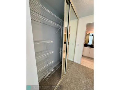 Move-in ready in the heart of Davie close to highways on Pine Island Ridge Country Club in Florida - for sale on GolfHomes.com, golf home, golf lot