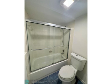 Move-in ready in the heart of Davie close to highways on Pine Island Ridge Country Club in Florida - for sale on GolfHomes.com, golf home, golf lot