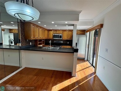 Move-in ready in the heart of Davie close to highways on Pine Island Ridge Country Club in Florida - for sale on GolfHomes.com, golf home, golf lot