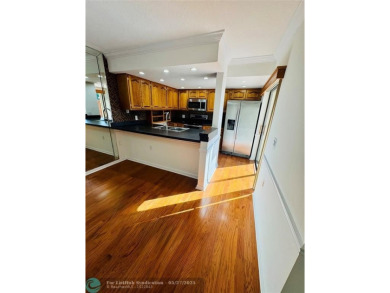 Move-in ready in the heart of Davie close to highways on Pine Island Ridge Country Club in Florida - for sale on GolfHomes.com, golf home, golf lot