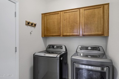 Inviting single-story with 3 beds, 2 baths, open kitchen with on Seville Golf and Country Club in Arizona - for sale on GolfHomes.com, golf home, golf lot