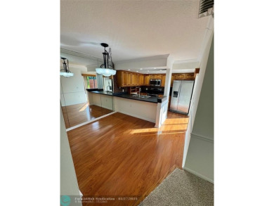 Move-in ready in the heart of Davie close to highways on Pine Island Ridge Country Club in Florida - for sale on GolfHomes.com, golf home, golf lot