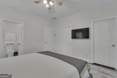 Warning!! This home may cause sudden daydreams of front porch on Whitewater Creek in Georgia - for sale on GolfHomes.com, golf home, golf lot