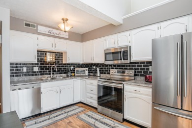 This three-level floor plan townhouse features clean updates and on Boone Links Golf Course in Kentucky - for sale on GolfHomes.com, golf home, golf lot