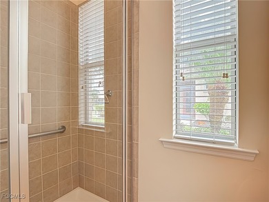 This spacious twin villa showcases breathtaking views of two on Herons Glen Golf and Country Club in Florida - for sale on GolfHomes.com, golf home, golf lot