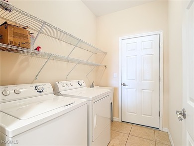 This spacious twin villa showcases breathtaking views of two on Herons Glen Golf and Country Club in Florida - for sale on GolfHomes.com, golf home, golf lot