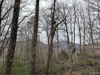 Nice winter mountain views of Chimneytop Mountain and on Sapphire National Golf Club in North Carolina - for sale on GolfHomes.com, golf home, golf lot