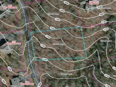 Nice winter mountain views of Chimneytop Mountain and on Sapphire National Golf Club in North Carolina - for sale on GolfHomes.com, golf home, golf lot