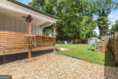 Welcome to this beautifully renovated 3-bedroom, 2-bathroom home on John A. White Golf Course in Georgia - for sale on GolfHomes.com, golf home, golf lot