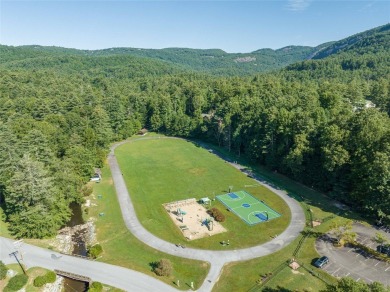 Nice winter mountain views of Chimneytop Mountain and on Sapphire National Golf Club in North Carolina - for sale on GolfHomes.com, golf home, golf lot