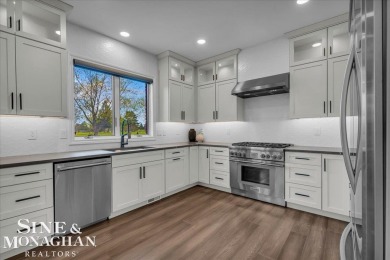 Not a single detail was spared in this sprawling custom brick on St Clair River Country Club in Michigan - for sale on GolfHomes.com, golf home, golf lot