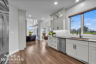 Not a single detail was spared in this sprawling custom brick on St Clair River Country Club in Michigan - for sale on GolfHomes.com, golf home, golf lot