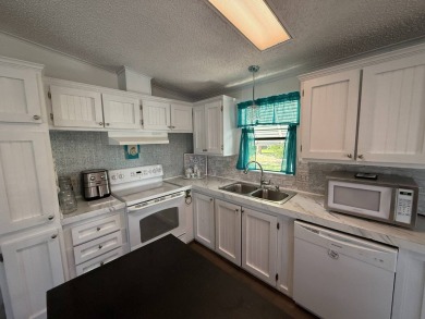 Welcome to this fully furnished, move-in ready 2-bedroom on Del Tura Golf and Country Club in Florida - for sale on GolfHomes.com, golf home, golf lot