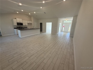 THIS HOME QUALIFIES FOR A LOW INTEREST RATE BUYDOWN WHEN BUYER on Pine Ridge Community Golf and Country Club in Florida - for sale on GolfHomes.com, golf home, golf lot