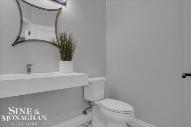 Not a single detail was spared in this sprawling custom brick on St Clair River Country Club in Michigan - for sale on GolfHomes.com, golf home, golf lot