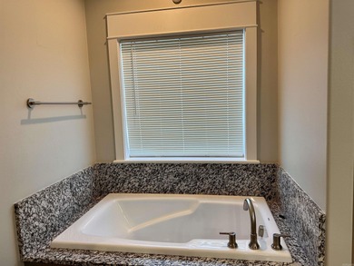 This house located in the Mystic Creek Golf Club area packs a on Mystic Creek Golf Club in Arkansas - for sale on GolfHomes.com, golf home, golf lot