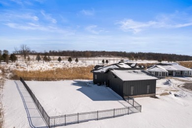 This stunning 4-bedroom ranch, plus office/den and 3 bathrooms on Bishops Bay Country Club in Wisconsin - for sale on GolfHomes.com, golf home, golf lot