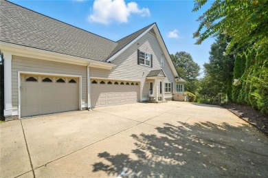 Overlooking manicured fairways and a sparkling lake, this home on The Golf Club At Bradshaw Farm in Georgia - for sale on GolfHomes.com, golf home, golf lot