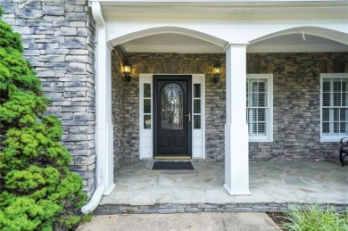 Overlooking manicured fairways and a sparkling lake, this home on The Golf Club At Bradshaw Farm in Georgia - for sale on GolfHomes.com, golf home, golf lot