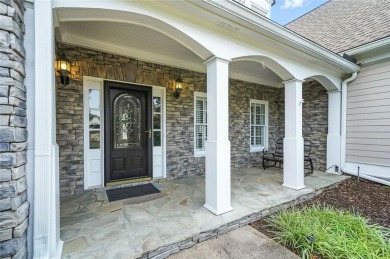 Overlooking manicured fairways and a sparkling lake, this home on The Golf Club At Bradshaw Farm in Georgia - for sale on GolfHomes.com, golf home, golf lot