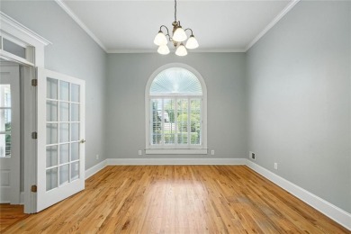 Overlooking manicured fairways and a sparkling lake, this home on The Golf Club At Bradshaw Farm in Georgia - for sale on GolfHomes.com, golf home, golf lot