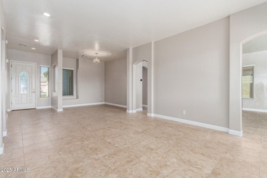 Gated community living at its best! This 4-bedroom, 2-bath home on Palm Valley Golf Club  in Arizona - for sale on GolfHomes.com, golf home, golf lot